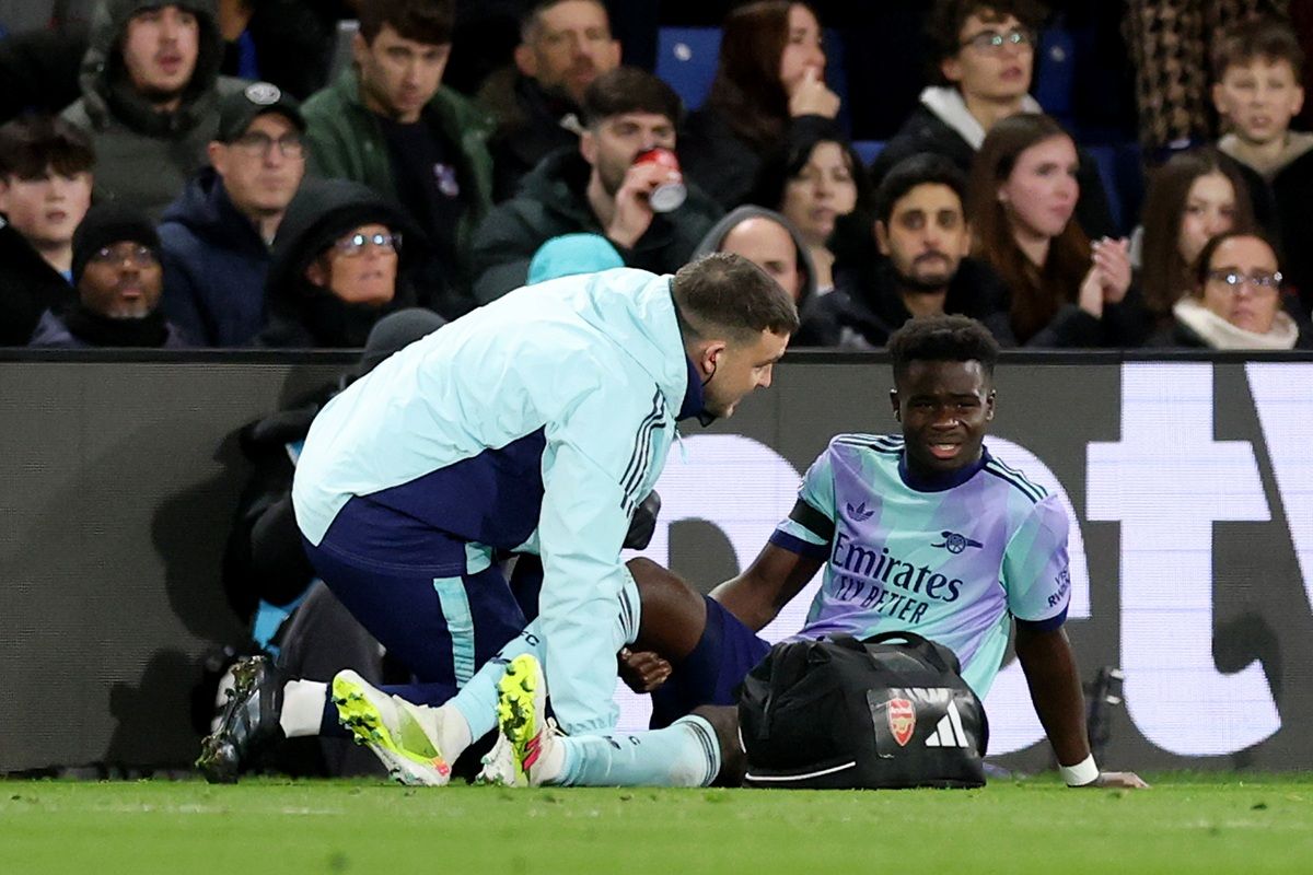 Premier League physio attending to injured player